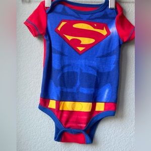 SUPERMAN TM& DC COMICS (s15)  INFANTS 👶 6-9 MONTHS. BLUE,RED, YELLOW ONESIE.